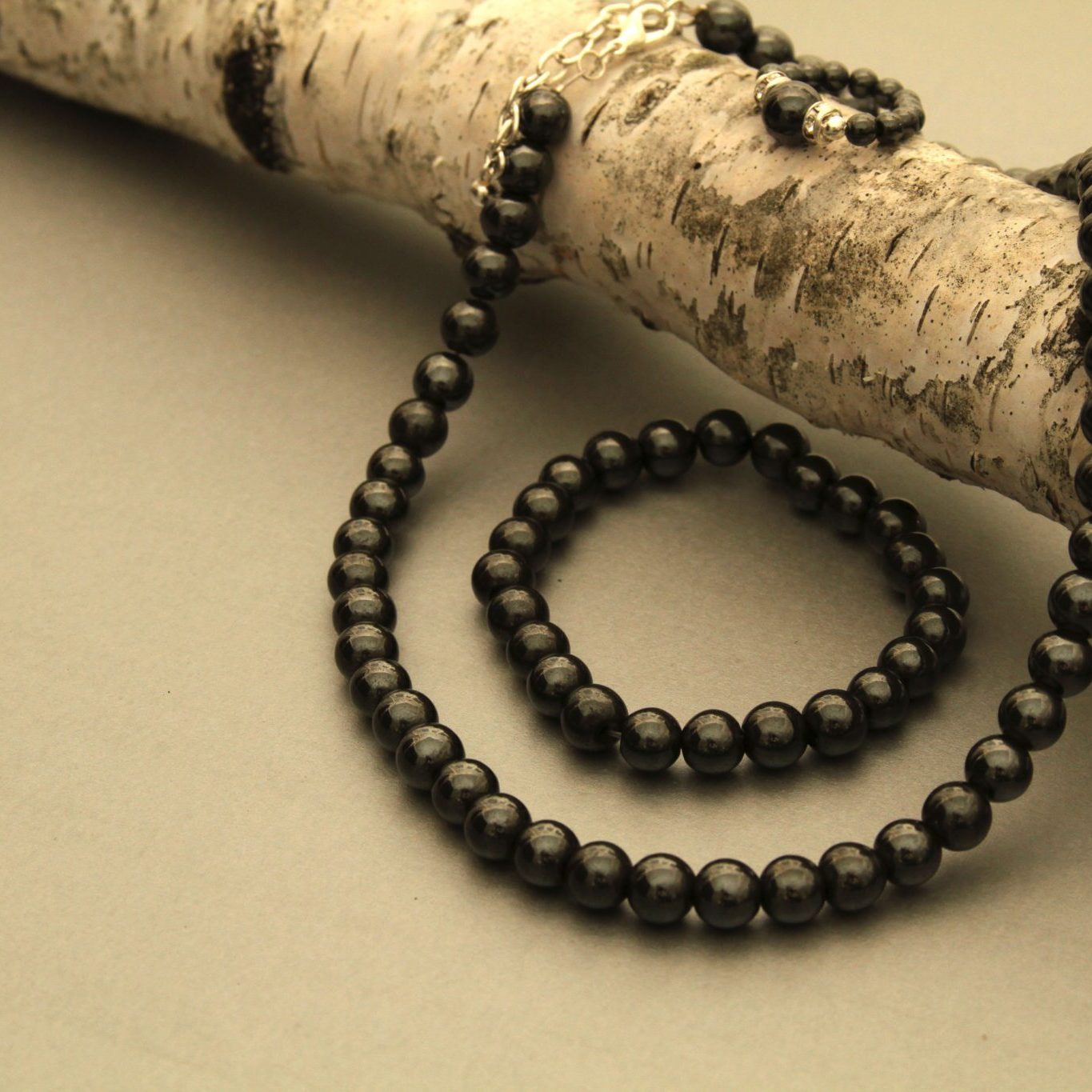 black magnetic ring, bracelet, and necklace set