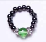 Black beaded stretch ring with Peridot ball accent