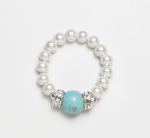 White beaded stretch ring with turquoise accent ball