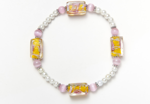 white magnets, pink cat's eye, and yellow and pink lampwork beaded bracelet