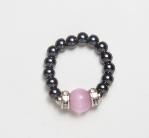 black magnetic stretch ring with pink cats eye accent bead