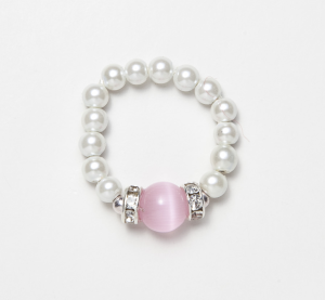 white beaded stretch ring with pink cats eye circular accent bead