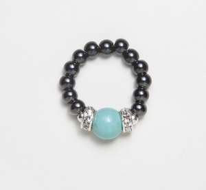 black beaded stretch ring with turquoise ball accent bead
