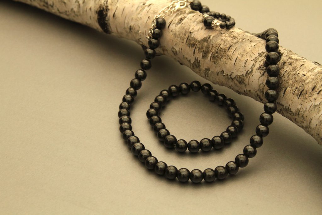 black magnetic ring, bracelet, and necklace set